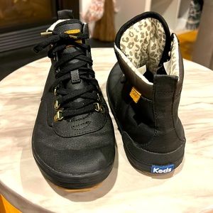 Keds black leather high tops. Gold hardware. Size 8W.
